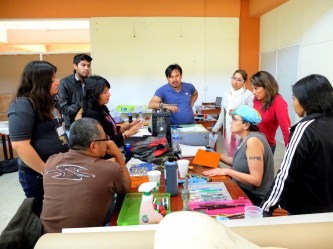 Professor of Art Max White and students in the solar plate graphics workshop